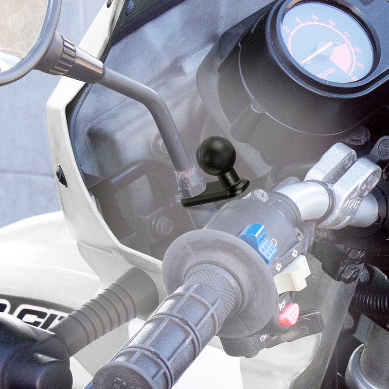 Close-up of a motorcycle handlebar with controls, a rear-view mirror, and a 25mm Ball to 11mm Bolt Head Adapter mounted near the throttle grip. The dashboard and speedometer are partially visible in the background.