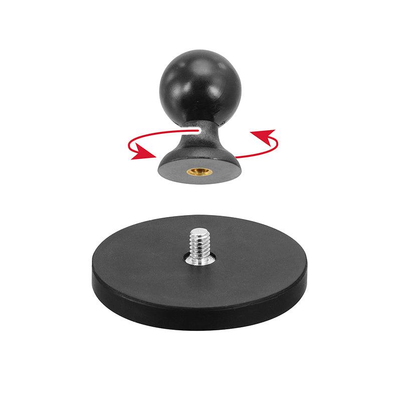 A round black knob with a metal threaded insert hovers above the 65mm Diameter Round Heavy-Duty Magnetic Base with 25mm (1 inch) Ball, showing attachment by twisting as indicated by red arrows.