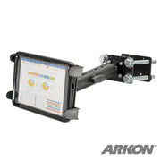 The 7.25 inch Metal Robust Forklift Front Guard Slim-Grip® Tablet Mount secures a tablet showing charts and graphs. The black adjustable holder is bolted to a flat metal surface, with the ARKON logo visible in the bottom right corner.