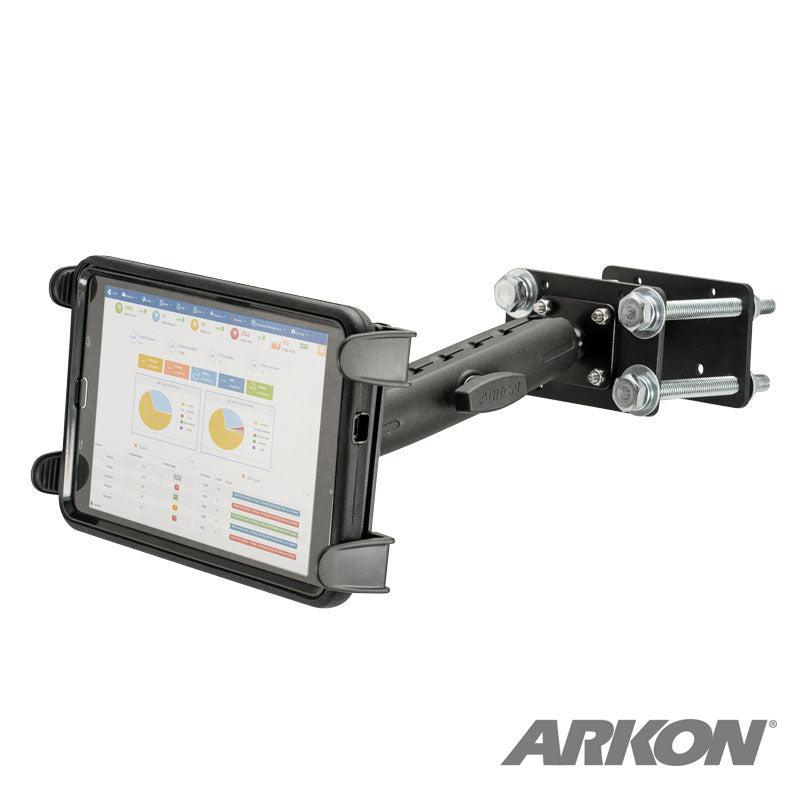 The 7.25 inch Metal Robust Forklift Front Guard Slim-Grip® Tablet Mount secures a tablet showing charts and graphs. The black adjustable holder is bolted to a flat metal surface, with the ARKON logo visible in the bottom right corner.