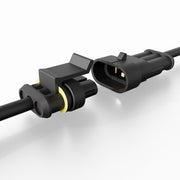 Two black plastic electrical connectors—one male, one female—from the Arkon Mounts 60W USB-C & USB-A Charging Harness rest close together on a smooth white surface, ready to be joined for dual charging applications with Quick Charge 3.0 support.