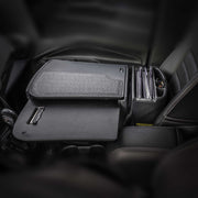 The front passenger seat is outfitted with the Arkon Mounts AutoExec GripMaster Car Desk, which includes a fold-out desk, clipboard, storage compartment for folders, and dedicated spaces for pens—making it an ideal mobile workstation for professionals on the move.