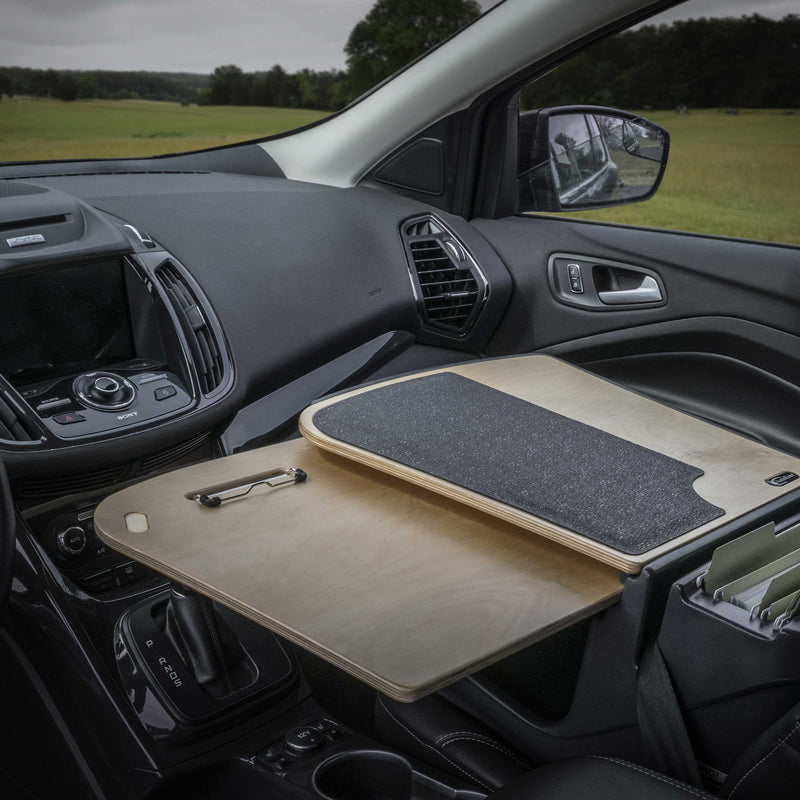 The Arkon Mounts AutoExec GripMaster Car Desk features a clipboard surface and attaches to the passenger seat, transforming it into a mobile workstation with file folder storage below.