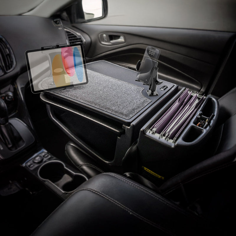 The AutoExec GripMaster Car Desk with Mega Grip™ and Slim-Grip® Ultra Pro Drill-Base Mounts transforms your front seat into the perfect mobile workstation, offering a secure tablet holder, spacious desk surface, phone mount, and organized file folders conveniently arranged on your passenger seat.