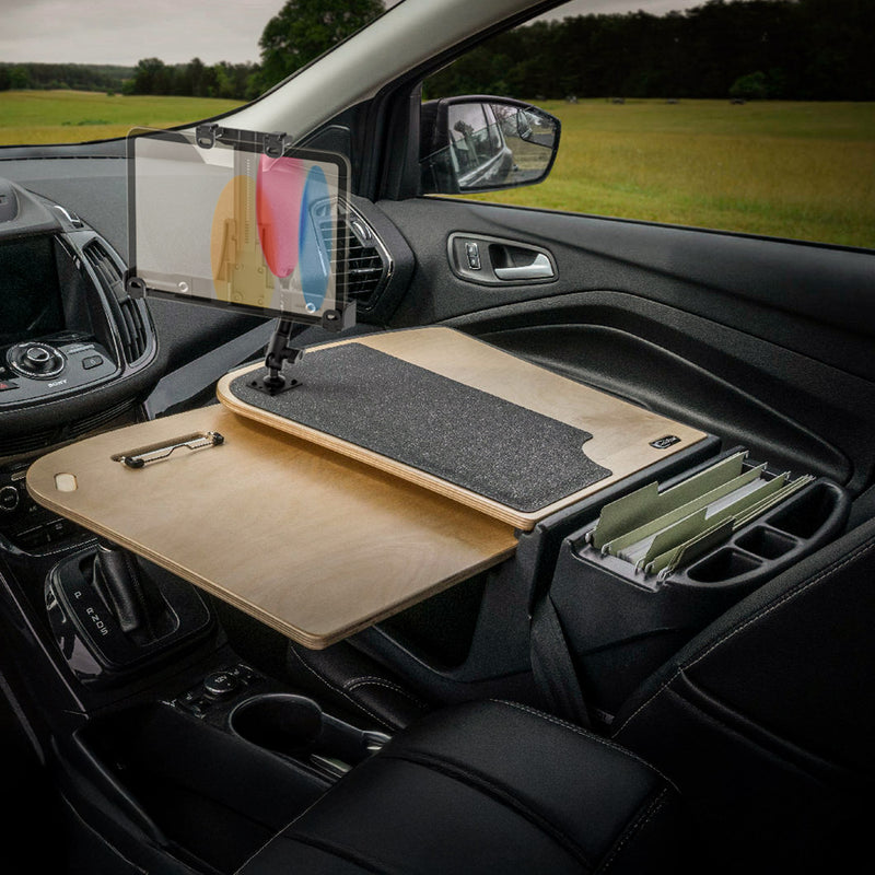 The front passenger seat of the car is equipped with the AutoExec GripMaster Car Desk featuring a LockVise™ Locking Tablet Holder with Multi-Angle Mount, clipboard, document folders, and cup holders—transforming the space into an efficient mobile workstation.