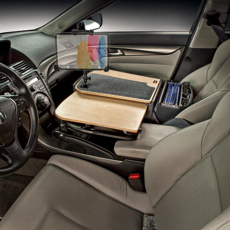 The car interior showcases the AutoExec GripMaster Car Desk with LockVise™ Locking Tablet Holder and Multi-Angle Mount, featuring a wooden workstation spanning the passenger seat, a secure locking tablet holder mounting your device, neatly organized folders on the side, and an unoccupied driver’s seat. This setup is expertly designed as a mobile office workstation for use on the go.