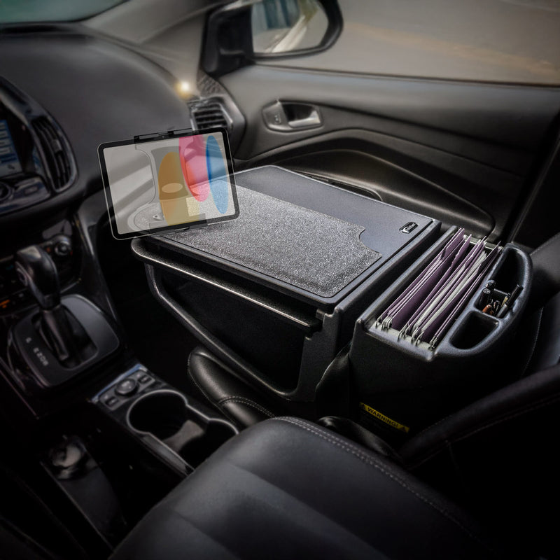 The AutoExec GripMaster Car Desk by Arkon Mounts transforms your car’s front seat into a modern, mobile workstation, featuring an organizer on the center console that secures file folders and a closed laptop, while the Slim-Grip® Ultra Pro Drill-Base Mount conveniently props up your tablet above.