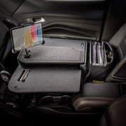 The AutoExec GripMaster Car Desk with LockVise™ Locking Tablet Holder and Multi-Angle Mount transforms your car’s front passenger seat into a mobile workstation, featuring a sturdy desk surface, secure locking tablet holder, organized file slots, and a convenient pen holder for efficient work on the go.