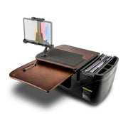 The AutoExec GripMaster Car Desk with LockVise™ Locking Tablet Holder and Multi-Angle Mount features a black and brown mobile workstation with a document holder, clipboard, file organizer, and a mounted transparent screen. This all-in-one car desk includes office supplies arranged on and around the workspace, along with a secure locking tablet holder for enhanced convenience.
