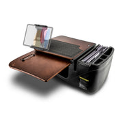 A portable workstation with a brown writing surface, clipboard, pen holder, felt pad, and compartments for files and folders—all contained within a black plastic organizer—this setup matches the AutoExec GripMaster Car Desk with Slim-Grip® Ultra Pro Drill-Base Mount by Arkon Mounts, making it the ideal mobile workstation for busy professionals.