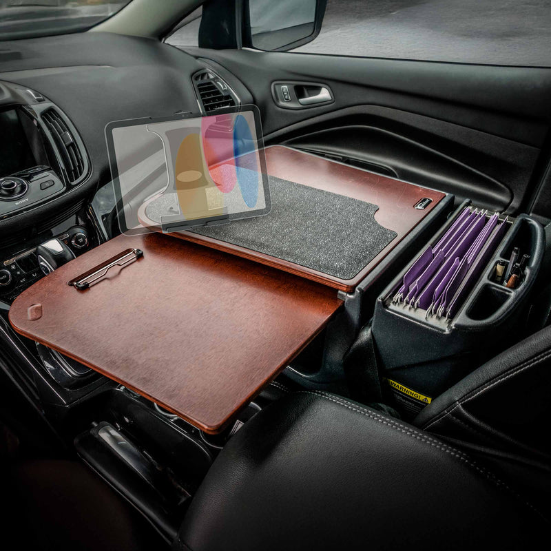 Turn your car’s front seat into a mobile workstation with the AutoExec GripMaster Car Desk with Slim-Grip® Ultra Pro Drill-Base Mount by Arkon Mounts. Designed with a wooden desk organizer, dedicated file folder slots, and a secure tablet mount, this setup transforms your passenger seat into an efficient office space—delivering professional-grade productivity right from your vehicle.