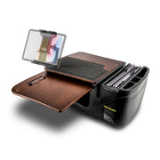 Introducing the AutoExec GripMaster Car Desk with Slim-Grip® Ultra Pro Multi-Angle Mount by Arkon Mounts—a portable black car desk featuring an organized brown writing surface, clipboard, paper storage slots, and compartments for files and office supplies. This mobile office also includes a convenient tablet holder for enhanced productivity on the road, with well-arranged sections and a clipboard securing colored folders.