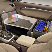 The front passenger seat is equipped with the Arkon Mounts GripMaster Efficiency Car Desk with Slim-Grip® Ultra Pro Drill-Base Mount, providing a fold-out surface for your laptop, organized holders for paperwork and pens, and a convenient tablet holder—all designed to create an efficient mobile office within your vehicle.