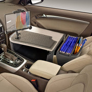With the AutoExec GripMaster Efficiency Car Desk featuring the LockVise® Locking Tablet Holder and Multi-Angle Mount, your car’s front seat becomes a mobile workstation—complete with an organizer on the passenger side, a secure tablet holder, writing mat, and compartments stocked with blue file folders and pens. This car desk setup keeps essentials within reach while leaving the gear shift and controls easily accessible.