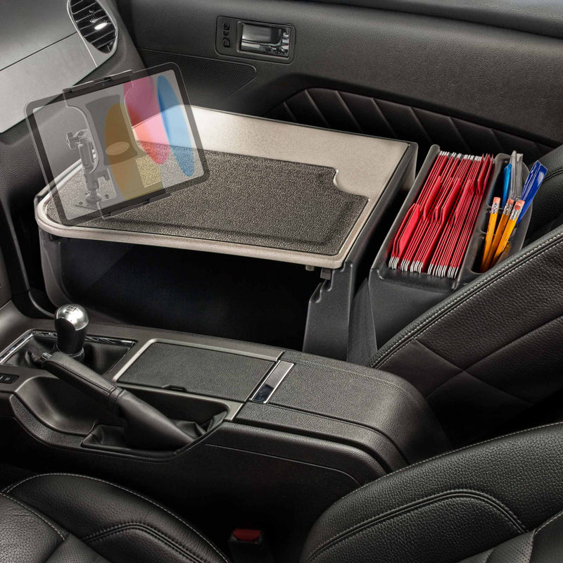 Transform your car’s front seat into a mobile office with the AutoExec GripMaster Efficiency Car Desk featuring Arkon Mounts’ Slim-Grip® Ultra Pro Multi-Angle Mount—a versatile tray that securely holds your tablet. The organized workstation includes red folders and pens, with the gear shift and armrest beside it for easy access on the go.