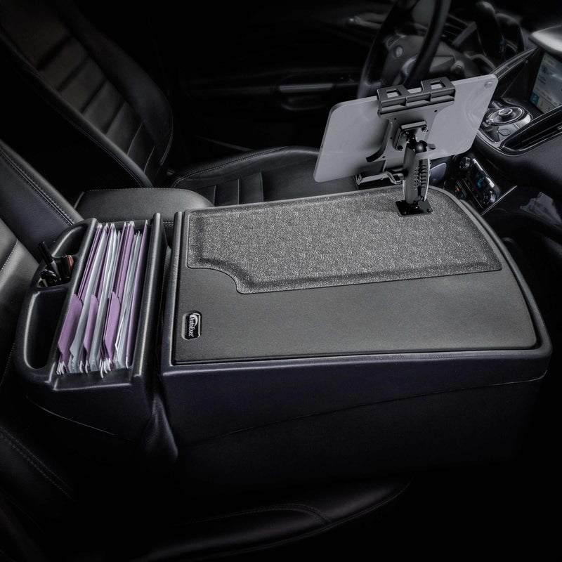 Here’s a revised version of the sentence using your provided product data: A car’s front seat equipped with the Arkon Mounts GripMaster Efficiency Car Desk, featuring a Slim-Grip® Ultra Pro Drill-Base Mount, holds hanging file folders and includes a mounted tablet holder, creating an organized workspace for managing documents and digital devices while parked.