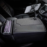 The AutoExec GripMaster Efficiency Car Desk with Slim-Grip® Ultra Pro Multi-Angle Mount by Arkon Mounts securely holds your tablet on a versatile stand attached to your car’s central armrest and features integrated file folder storage. This innovative design transforms your front seat into a professional mobile office, making it the perfect car desk solution for busy professionals on the move.