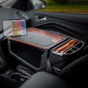 The Arkon Mounts GripMaster Efficiency Car Desk with Slim-Grip® Ultra Pro Drill-Base Mount is set up on the front passenger seat of a car, providing an organized workspace on the go with file folders, a work surface, and a tablet holder.