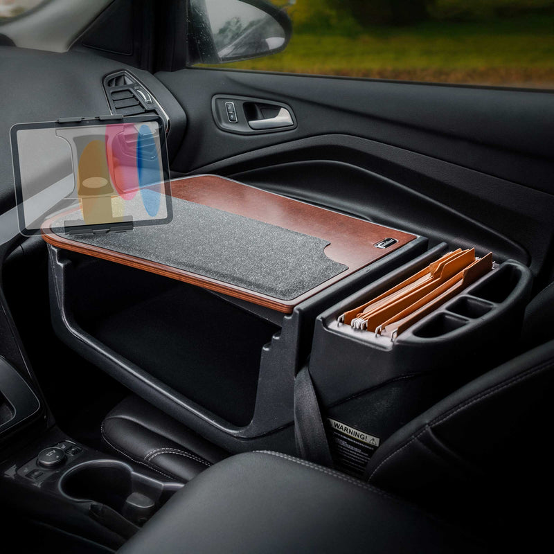 The Arkon Mounts GripMaster Efficiency Car Desk with Slim-Grip® Ultra Pro Drill-Base Mount is set up on the front passenger seat of a car, providing an organized workspace on the go with file folders, a work surface, and a tablet holder.