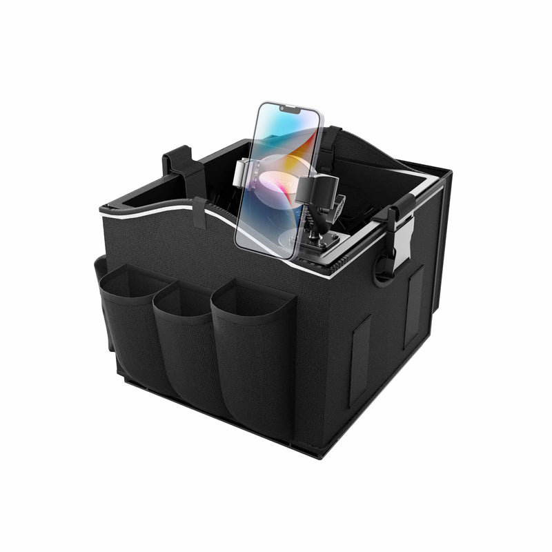 The Portable Crate Workstation with Apron Organizer – Choose Your Mounting Setup is shown in black, featuring three front pockets, side handles, a partitioned interior, and a mounted smartphone displaying a vibrant screen. Designed as a portable crate workstation, it conveniently holds various items while its device mounting feature keeps your mobile accessible. The organizer is presented on a white background.