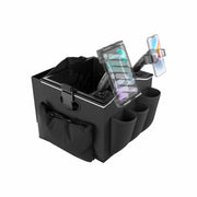 The Portable Crate Workstation with Apron Organizer – Choose Your Mounting Setup is a black storage solution featuring multiple pockets and compartments, expertly designed to serve as a convenient mobile workstation. It includes two adjustable device mounts that support both a tablet and a smartphone, ensuring efficient device mounting and organized accessory storage.