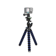 A Flexible 11 Tripod for GoPro HERO Action Cameras with black and blue striped, bendable legs holds a compact action camera upright on a white background.