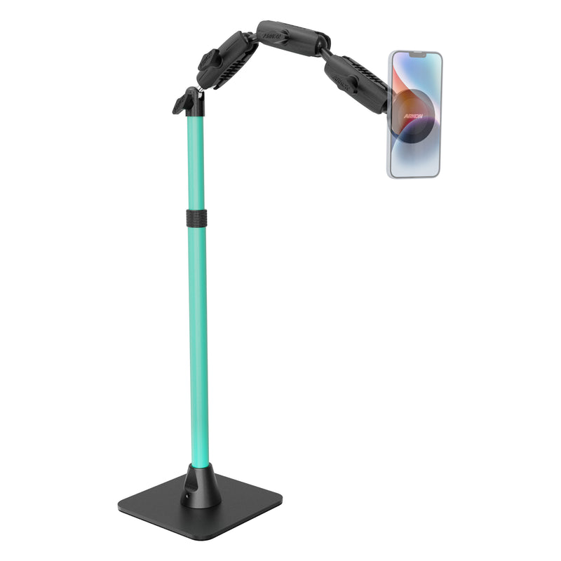 The Remarkable Creator™ Pro Mount with MagSafe Compatible Holder, shown in teal and black, keeps a smartphone securely in a horizontal position with its weighted black base and multiple adjustable joints for flexible positioning. Perfect for creator content setups, it displays the phone’s colorful screen prominently.