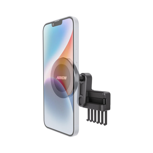 Arkon Mounts Magnetic Vent Phone Mount for Tesla Model 3 2017–2022 & Model Y 2020–2023 attached to a vehicle vent, featuring a multi-pronged clip holding a smartphone.