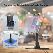 The Slim-Grip® Ultra Pro POS Tablet Stand, featuring a 360° swivel, vibration-resistant weighted base, and 7.5″ adjustable pole, is showcased in a blurred café environment. This countertop POS Tablet Stand is specifically designed for efficient use in retail and restaurant settings, with inset images highlighting the main features of the Retail and Restaurant Tablet Holder.