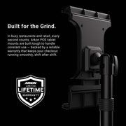 The Slim-Grip® Ultra Pro POS Tablet Stand, expertly designed as a black Retail and Restaurant Tablet Holder, features a shield icon labeled Lifetime Warranty, with text highlighting its outstanding durability and warranty for busy restaurant and retail environments.