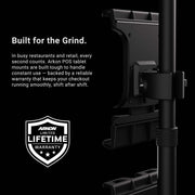 A black Slim-Grip® Ultra Pro POS Tablet Mount with Triple Holders is securely attached to a pole, highlighting its exceptional durability and backed by a limited lifetime warranty. An eye-catching white badge displays “Arkon Limited Lifetime Warranty.” Purpose-built for bustling restaurants and retail environments, this mount is the ideal complement to any Retail POS system setup.