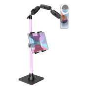 The Remarkable Creator™ Pro+Plus Mount with MagSafe Compatible Holder features a pink adjustable stand with articulated arms and a sturdy black base, allowing you to securely position both your tablet and smartphone—with an attached ring light—making it the ideal mount for content creators.
