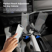 A hand adjusts a smartphone in the Mega Grip™ Phone Holder with Seat Wedge Mount inside a vehicle. The phone displays a map. Text reads: Perfect Reach Adjustment for Any Vehicle. Blue arrows indicate adjustable positions.