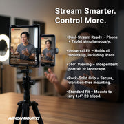 A man sits at a desk speaking in front of his phone and tablet, both secured on the Arkon Mounts Robust® Shaft Phone & Tablet Holder Pedestal for Camera Tripods with RoadVise® and Slim-Grip®, which offers features such as dual live streaming, universal fit, 360° viewing, strong grip, and tripod compatibility.
