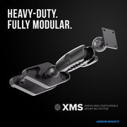 A modular and heavy-duty mounting system featuring ball-and-socket joints and rectangular plates—perfect for use as a robust tablet or forklift mount. Text reads: HEAVY-DUTY. FULLY MODULAR. XMS™ Heavy Duty Forklift Mount with AMPS Adapter Plate by Arkon Mounts. Arkon Mounts logo in blue.