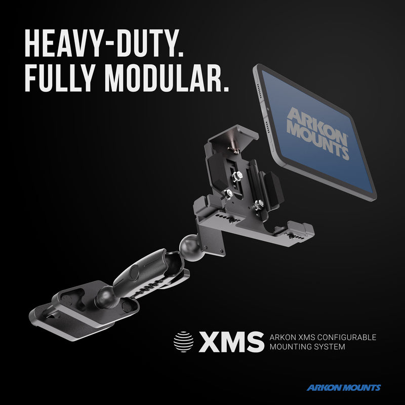 A modular mounting system, the XMS™ Heavy Duty Forklift Mount with LockVise™ Metal XL Locking Tablet Holder, is ideal for warehouse tablet mounting and holds a tablet labeled Arkon Mounts. Bold text reads, Heavy-Duty. Fully Modular. XMS™ and Arkon Mounts branding are visible on a black background.