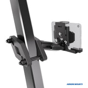 The XMS™ Heavy Duty Forklift Mount with LockVise™ Metal Locking Tablet Holder is securely attached to a thick metal beam, holding a smartphone horizontally. The Arkon Mounts logo appears in the bottom right corner, highlighting its reliability as part of an industrial tablet mounting system.