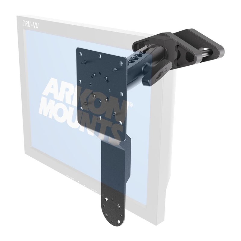 The XMS™ Heavy Duty Forklift Mount with Dual Utility Mounting Bracket by Arkon Mounts, finished in black, is attached to the top edge of a flat screen display featuring the TRU-VU label. Designed specifically as a warehouse device mount, this bracket offers multiple holes for adjustable positioning and is compatible with both VESA and AMPS mounting standards.