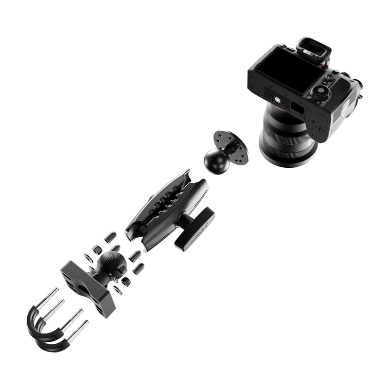 A black XMS™ U-Bolt Mount with Camera Pedestal is shown above an exploded view of its heavy-duty mount and hardware, including clamps, a ball joint, and connecting components, all aligned in assembly order on a white background.
