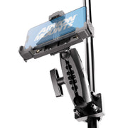 A close-up of a smartphone mounted on the XMS™ U-Bolt Mount with LockVise™ Locking Phone Holder, an adjustable black and gray device securely attached to a pole. The phone screen displays the text ARKON MOUNTS, showcasing secure device mounting with this heavy-duty phone holder.