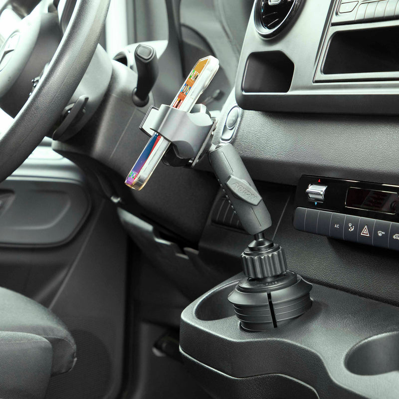 The RoadVise® Ultra Holder with Cup Holder Mount is positioned beside the driver’s seat and dashboard controls, providing easy hands-free access to your phone or tablet while on the road.