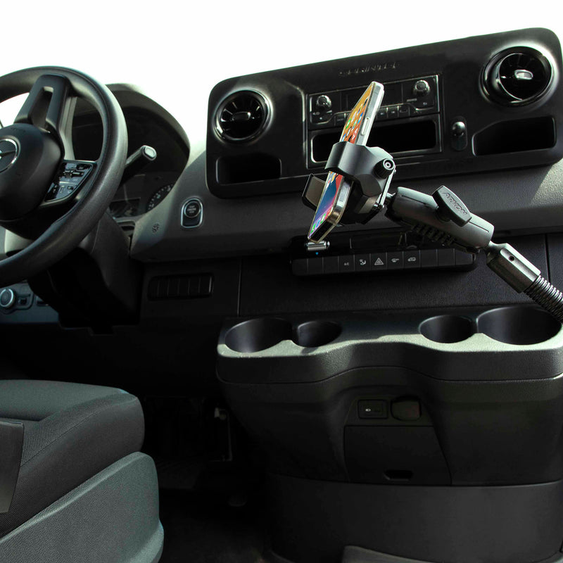 A smartphone is securely mounted using the RoadVise® Ultra Holder with Heavy-Duty Seat Rail Mount, which attaches to a vehicle’s seat rail near the console, cup holders, and dashboard controls, providing convenience and stability comparable to a heavy-duty tablet mount.