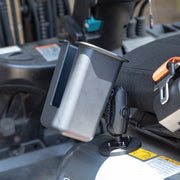 An Arkon Mounts Magnetic Mount Device & Barcode Scanner Holder, made of gray plastic and designed for industrial use, is securely attached to a metal base beside a vehicle seat—likely in a forklift—with the seatbelt and control panel visible in the background.
