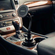 A Cup Holder Phone Mount with Gooseneck and 17mm Ball is installed in a car’s cup holder, providing a convenient and adjustable mounting solution amidst the car’s gear shift, controls, and wood trim interior.