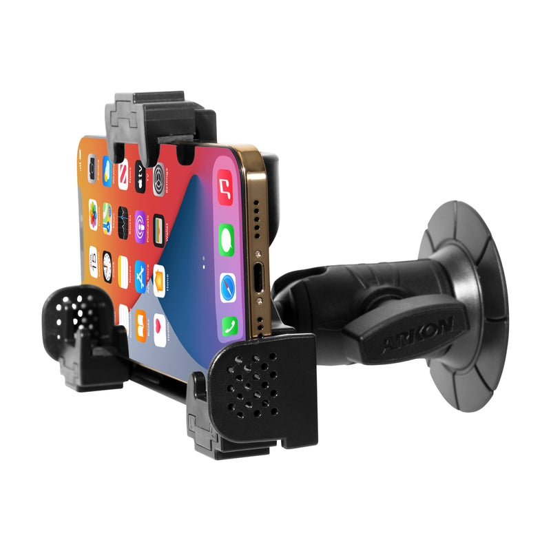 A smartphone is secured in the LockVise® Locking Phone Holder with an adjustable arm, attached to a surface using the OCTO™ Series Adhesive Mount. The phone screen shows app icons.