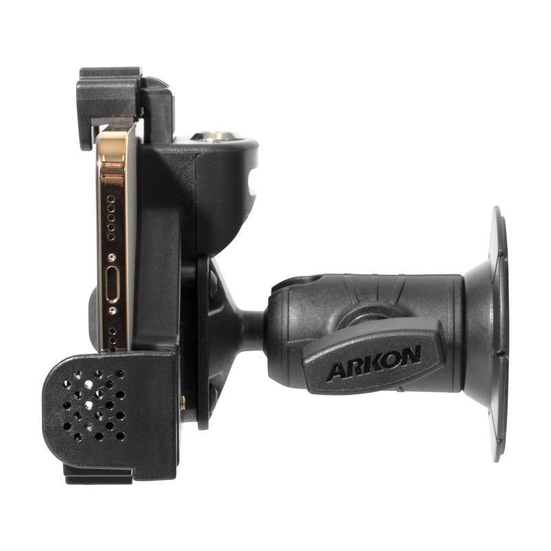 Side view of a black LockVise® Locking Phone Holder with OCTO™ Series Adhesive Mount and adjustable arm, holding a smartphone securely and displaying the phone’s charging port and speaker holes.