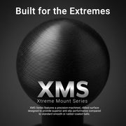 A black, ribbed spherical object—specifically the XMS Series - 1″ to 1″ Aluminum Ball Adapter by Arkon Mounts—displays text: Built for the Extremes. XMS Xtreme Mount Series. Further details highlight an anti-slip, precision-machined surface that underscores the rugged durability of this aluminum mounting adapter. The background is a minimalist gray.