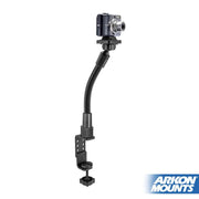 The Camera Holder with Clamp Mount and 12 Inch Adjustable Gooseneck Arm is clamped to a surface, securely holding a compact digital camera with a 1/4-20 mount. The Arkon Mounts logo appears in the bottom right corner.