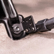 Close-up of the Car Seat Rail or Floor Mount with 22 Gooseneck and AMPS Head for Satellite Radios, a black metal bracket secured by bolt to carpet, featuring a coiled cable and using the 4-hole AMPS mounting pattern for secure attachment.