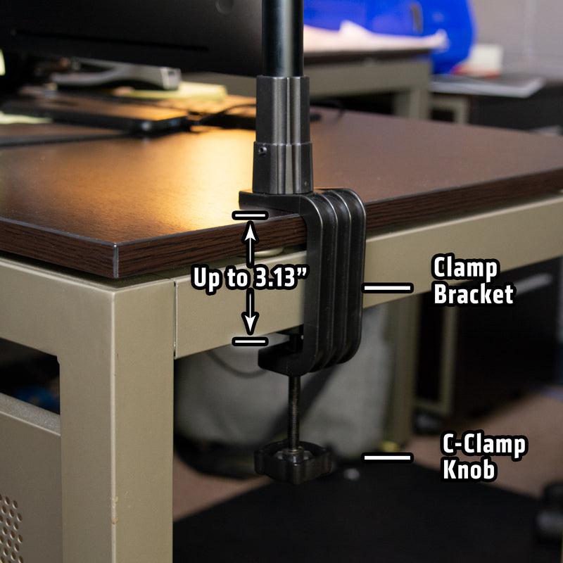 The Clamp for Converting Remarkable Creator™ Stands features a sturdy metal base that secures poles to wooden desks up to 3.13 thick, offering lightweight mounting near visible computer equipment as part of the Remarkable Creator Series.